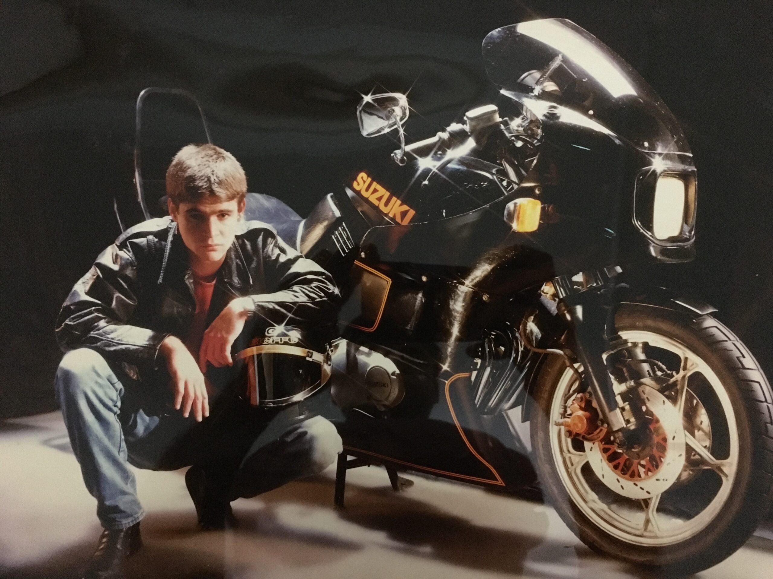 Young man next to motorcycle